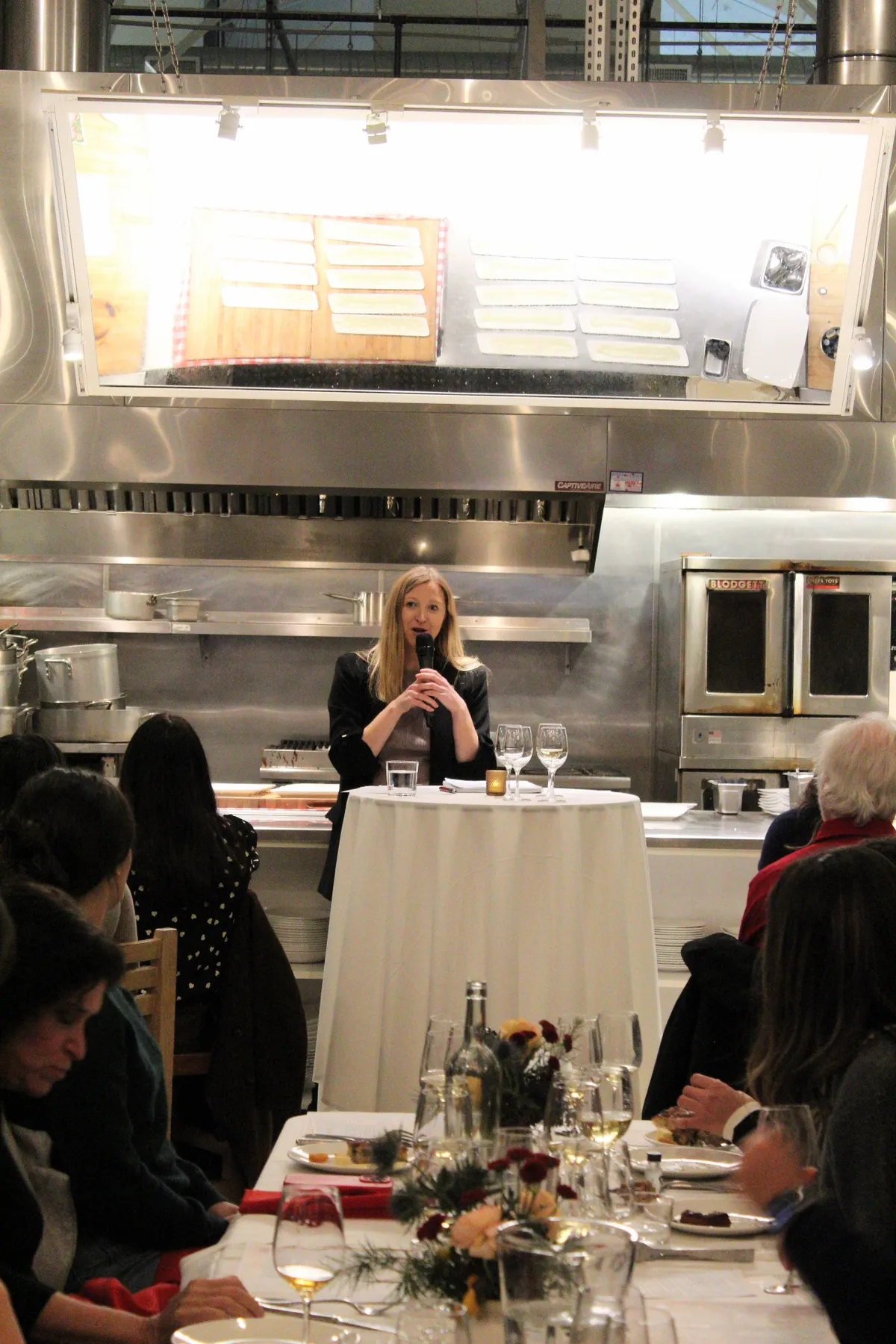 Gina speaking at event